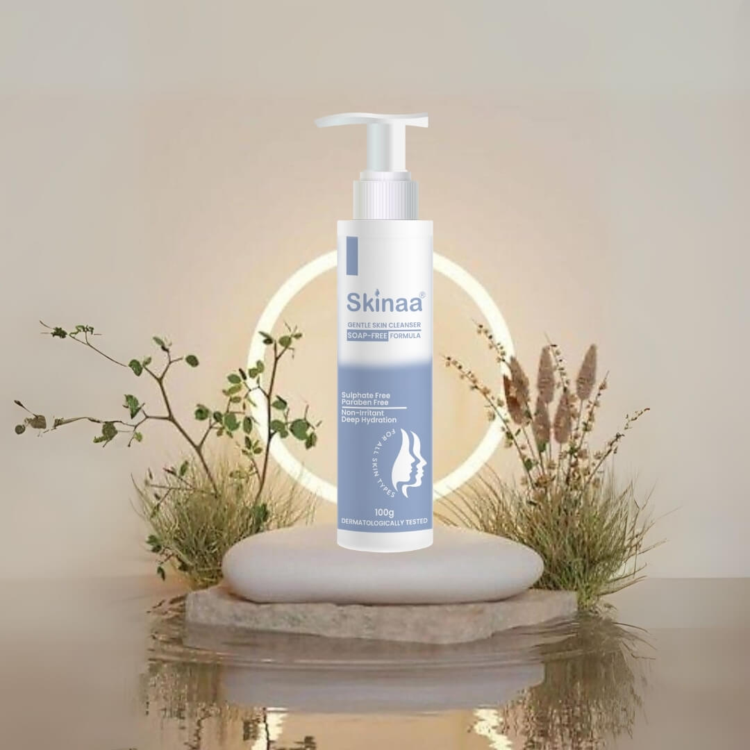 Skinaa Gentle Skin Cleanser bottle with pump displayed on a natural stone podium and glowing ring backdrop, dermatologically tested face cleanser for soft, clean, and hydrated skin