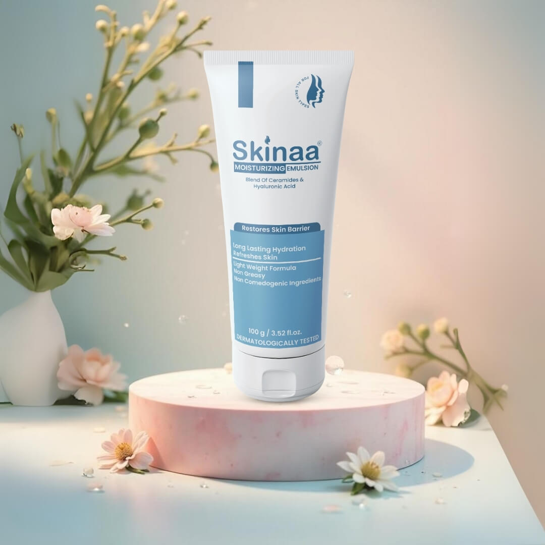 Skinaa Moisturizing Emulsion tube placed on a round podium with flowers. Dermatologically tested face moisturizer providing long-lasting hydration and skin barrier protection