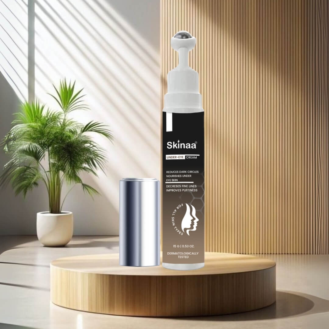 Skinaa Under Eye Serum bottle placed on a wooden podium with plants in the background, formulated to reduce dark circles, puffiness, and fine lines while improving skin texture