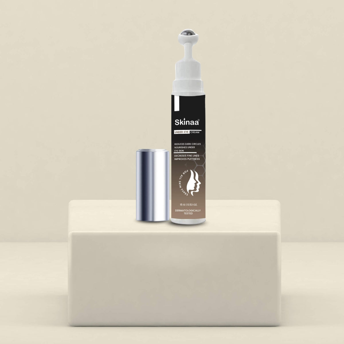 Skinaa Under Eye Serum bottle with metal roller applicator, designed to reduce dark circles, puffiness, and fine lines