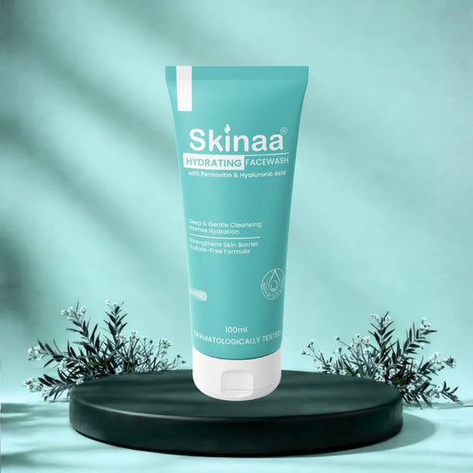 Skinaa hydrating facewash tube on a black platform with a green background